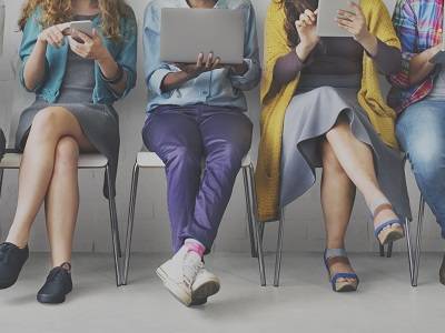 Group of peoples legs sat down